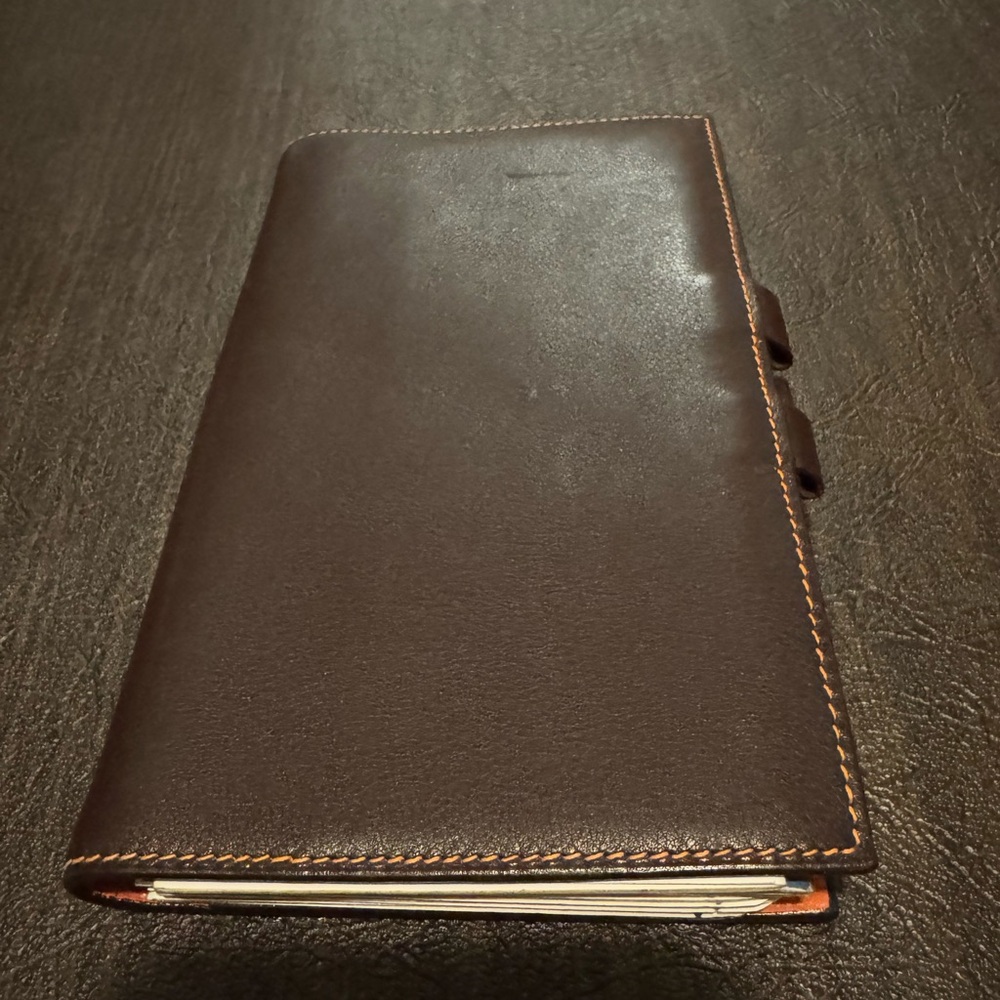 Hermes brown/orange planner.